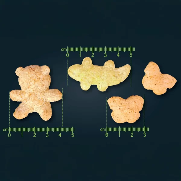 Extrudierte Knabbersnacks in Tierformen wie Bär, Krokodil und Fisch.